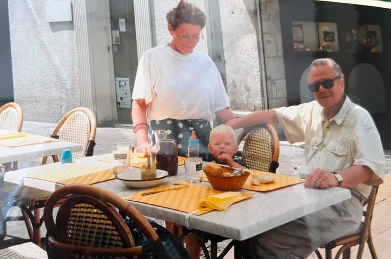 Lunch at a café table in town, three generations together